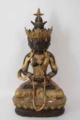 GUANYIN Statuette,vergoldet, Ostasien 20. Jahrhundert. Teils goldfarbig bemalte Statuette der