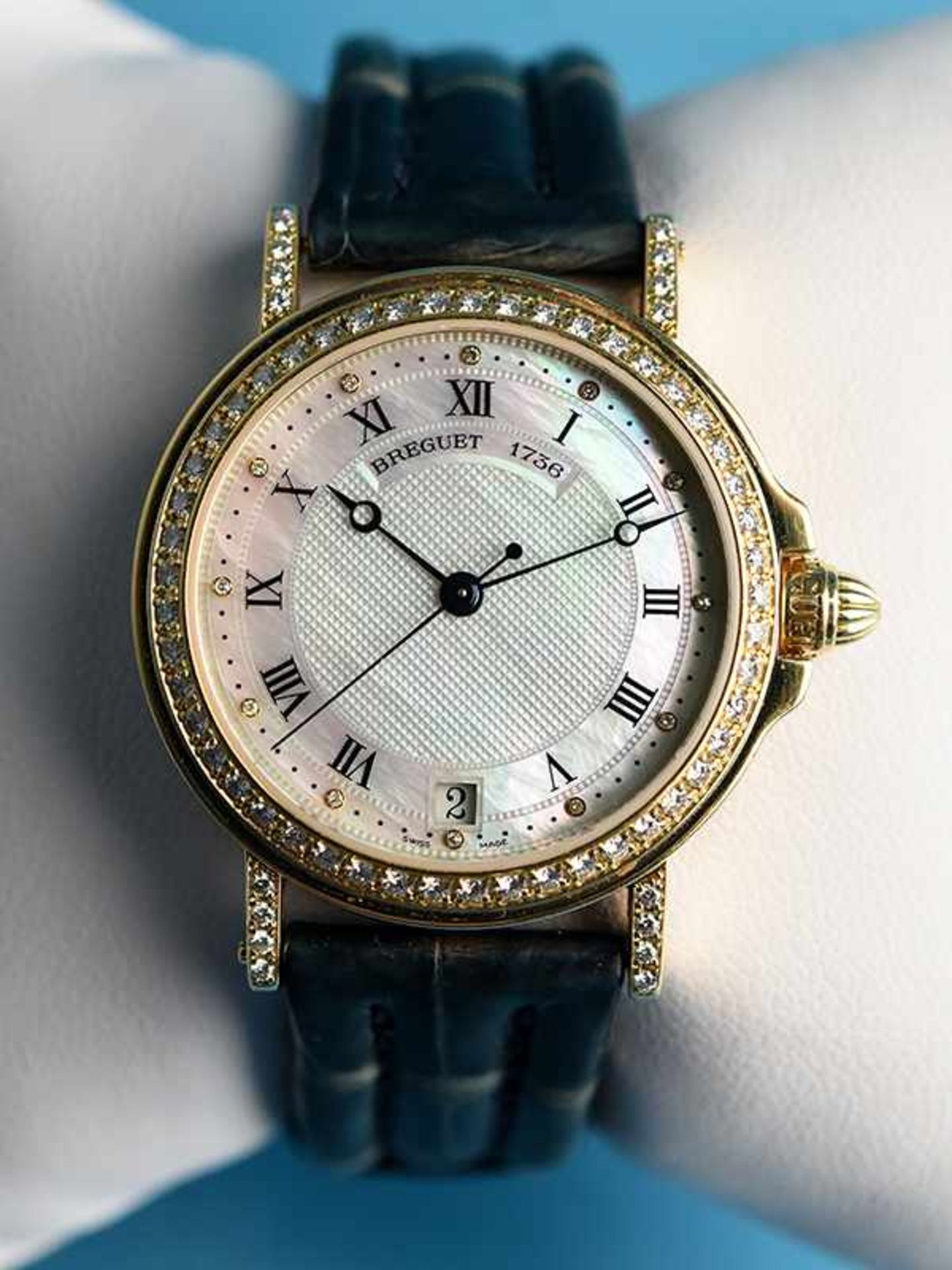 Armbanduhr mit 65 Brillanten, zusammen ca. 0,72 ct, bezeichnet "BREGUET 1736 - Modell MARINA, 20.