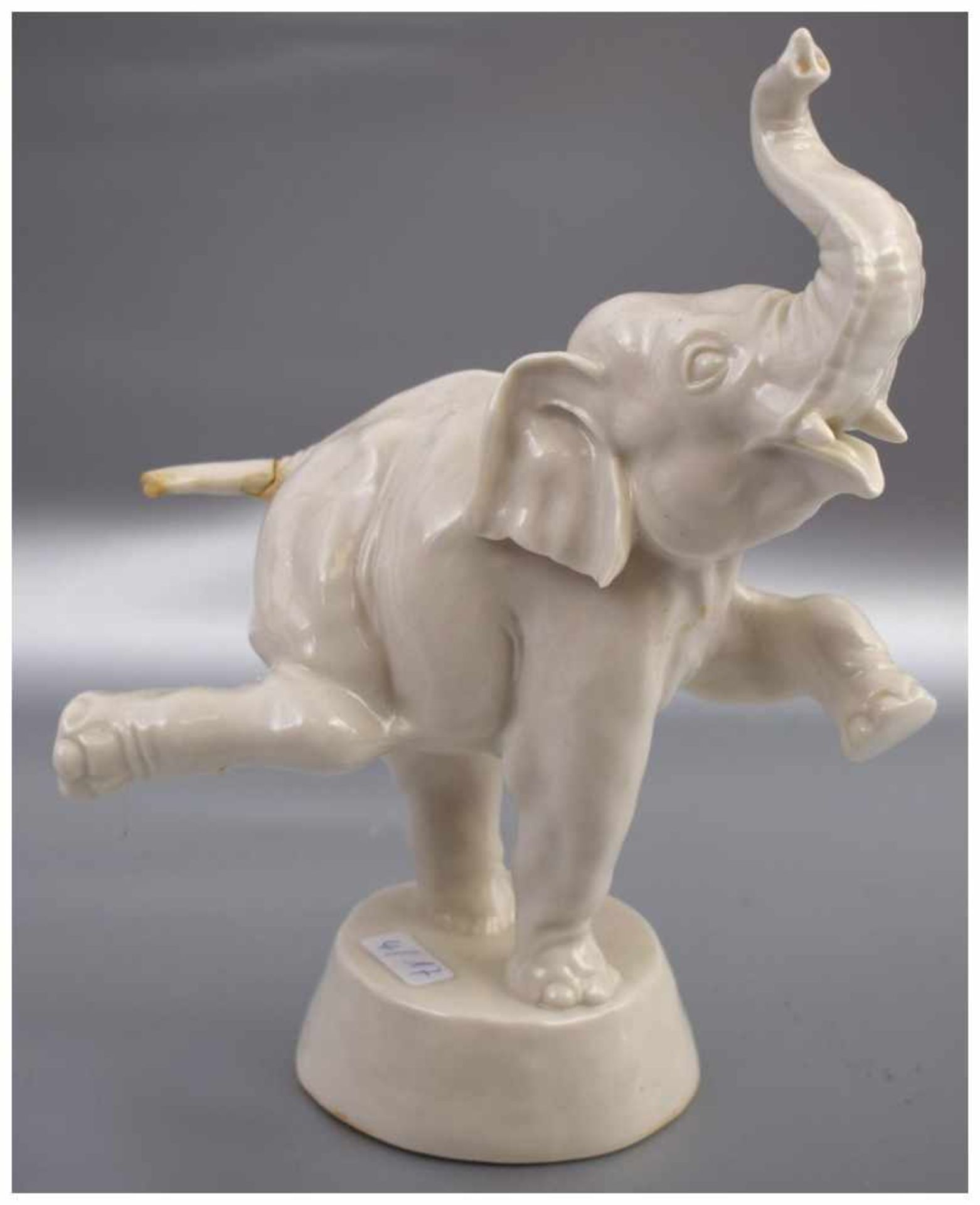 Zirkuselefant weiß glasiert, auf Sockel stehend, besch., H 19 cm, FM Nymphenburg