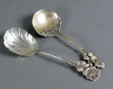 2 div. Sahnelöffel Silber 800 bzw. 835; Griffende mit Rosendekor; L: 12,5 bzw. 15 cm; zus. 46g