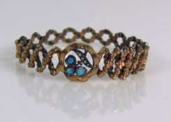 Spangenarmband (Ende 19.Jh.) 8ct GG; mittig besetzt mit Opalen, kleinen Perlen und kleinem Rubin;