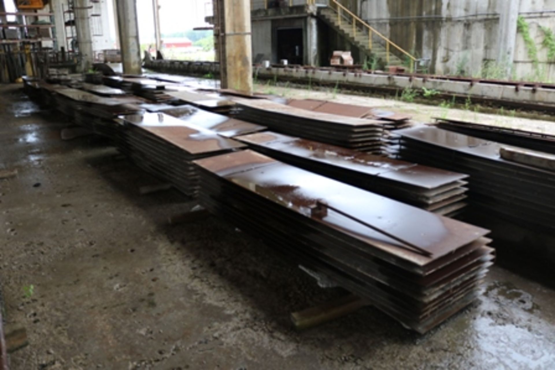 Approximately 35 piles of 2' x 10' steel panels for lines
