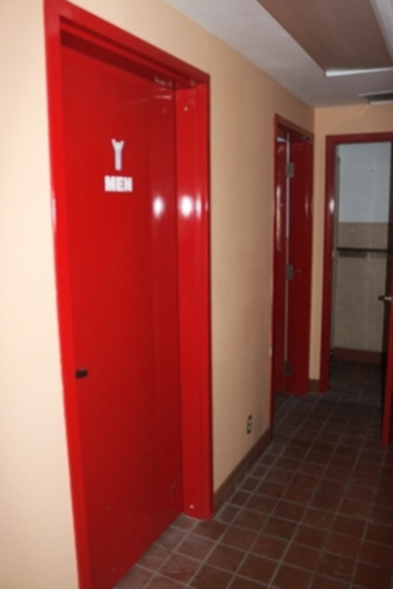 Mens and womens restrooms with 3 red steel doors (639)