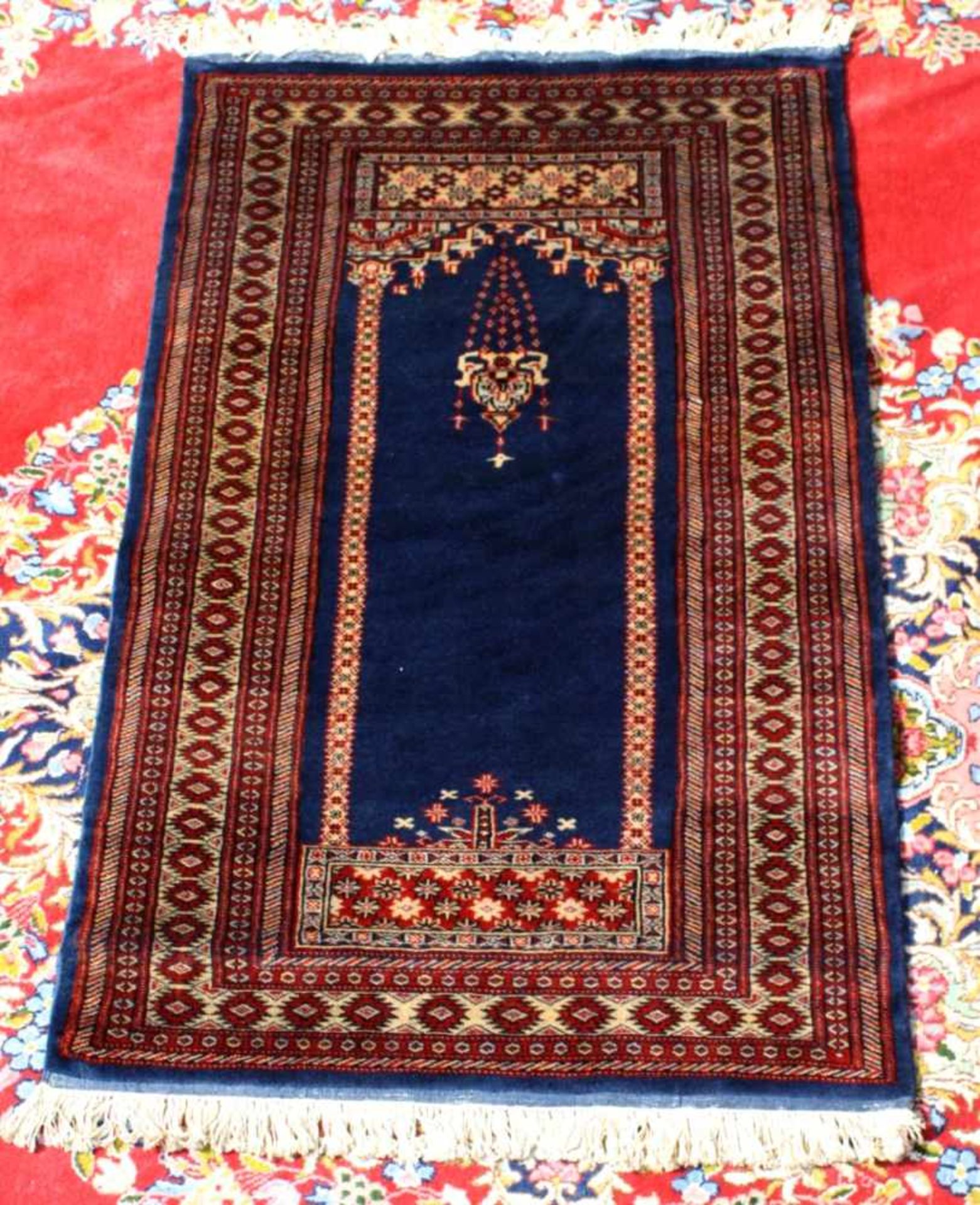 Orientalischer Teppichca. 128 cm x 77 cm, rot / blau