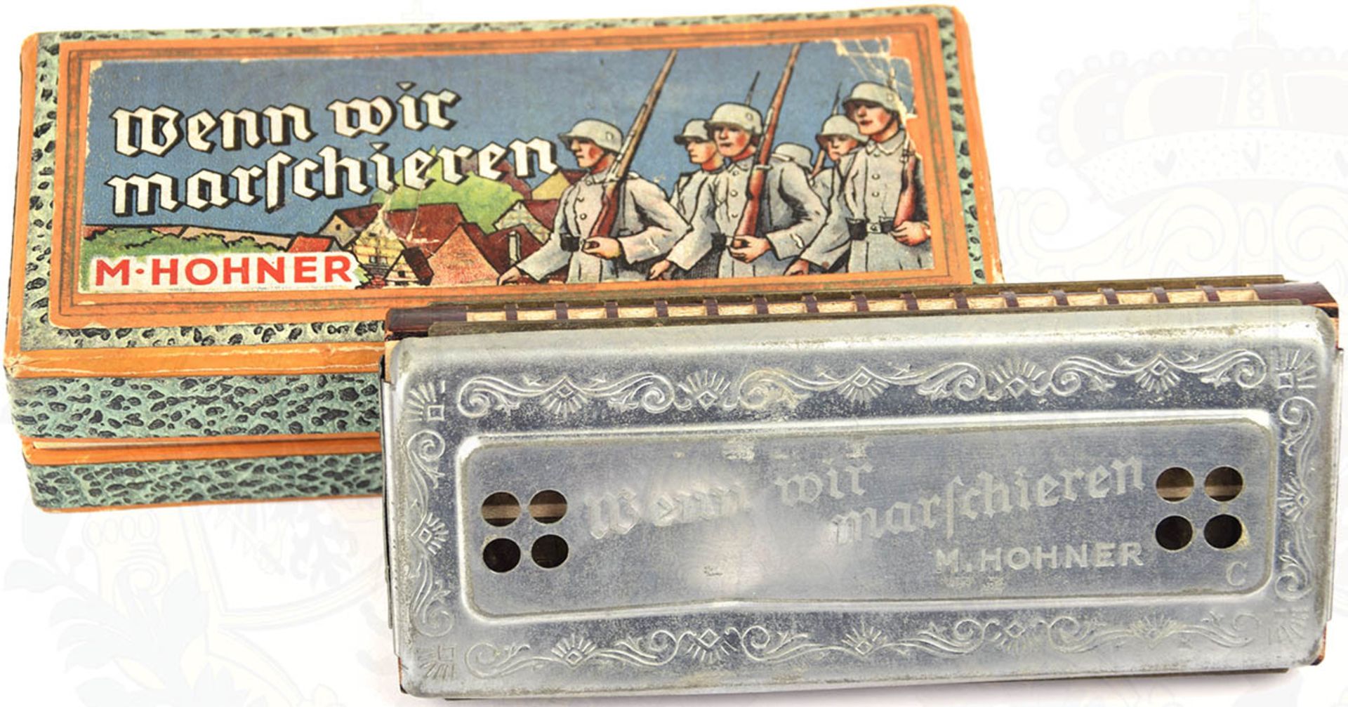 HOHNER-MUNDHARMONIKA, beidseitig spielbar, C u. G-Dur, Blech m. kleiner Delle, im Herst. Karton,