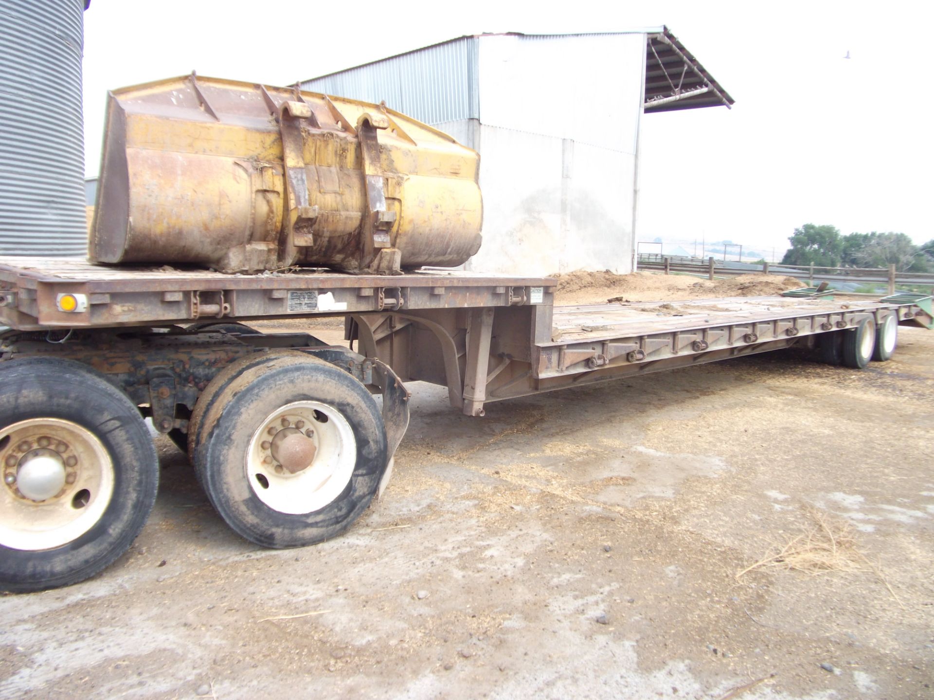 1- 1985 Great Dane 45’ step deck semi-trailer fold out sides & ramps