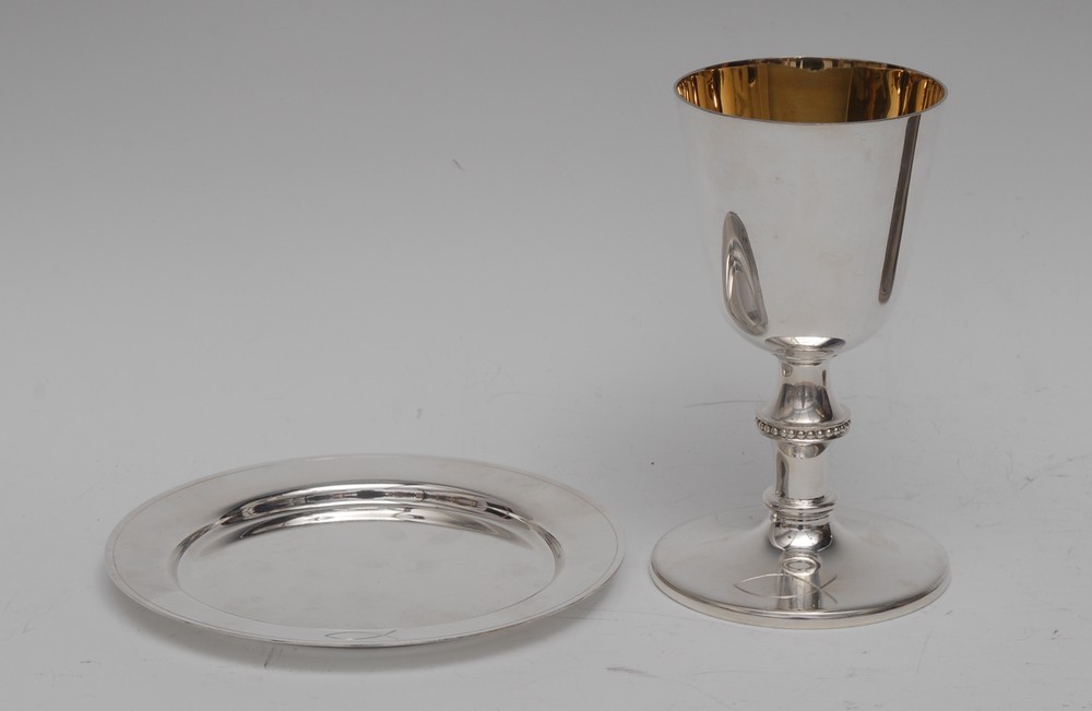 A modern silver chalice, knopped beaded stem, gilt interior, engraved with a fish, 17cm high,