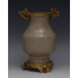 A gilt metal mounted Chinese crackle glazed pale grey celadon ovoid vase,