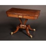 A Regency rosewood and brass marquetry rounded rectangular card table,