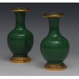 A pair of small gilt metal mounted Chinese monochrome ovoid vases, green crackle glaze, 11.