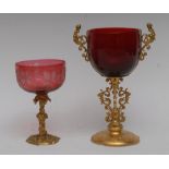 A late 19th/early 20th century gilt metal mounted and ruby glass goblet, rounded bucket shaped bowl,