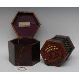 A concertina, by C Jones, twenty keys, leather trimmed paper bellows,