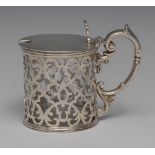A Victorian silver cylindrical mustard, pierced with leafy scrolls,