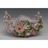 A 19th century Sitzendorf quatrefoil shaped bowl, encrusted overall with roses and other flowers,