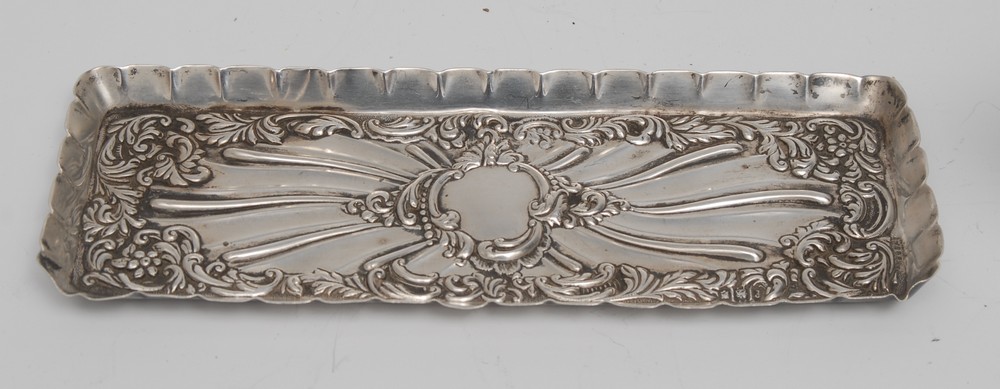 An Edwardian silver rounded rectangular dressing table trinket tray, wavy border,