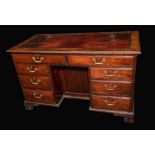 A substantial 19th century Chippendale Revival mahogany kneehole desk,