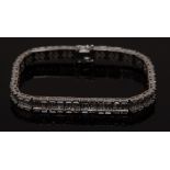 A diamond tennis bracelet, twenty seven box links,