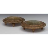 A pair of 19th century giltwood and gesso oval foot stools, fruiting vine and beaded borders,