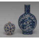 A Chinese blue and white moon flask, painted with scrolling dragons, the ground with lotus scrolls,