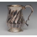 An Italian silver spirally fluted baluster pint mug, acanthus capped double-scroll handle,