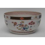 An 18th century Chinese bowl, the exterior decorated with stylised blossoming prunus branches,