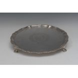 A George III silver shaped circular salver, gadrooned and fluted border, crested field,