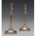 A composed pair of Victorian Adam Revival silver table candlesticks, of George III design,