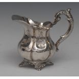 A 19th century Dutch silver melon shaped cream jug, acanthus scroll handle, cartouche shaped feet,