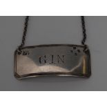 A Victorian silver curved rectangular wine label, Gin, engraved lettering and thread border, 4.