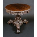 A 19th century Burmese/Anglo-Indian hardwood pedestal centre table, shaped circular tilting top,