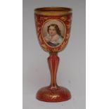 A 19th century Bohemian cranberry glass goblet, bucket shaped bowl, oval raised cartouche,