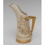 A Royal Worcester tusk jug, printed with ferns and coloured flowers on an ivory ground,