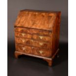 A George II design walnut bureau,