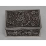 An Indian silver filigree rectangular box, the hinged cover with clover and further foliage,