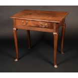 An 18th century oak lowboy, rounded rectangular moulded top above a long frieze drawer,