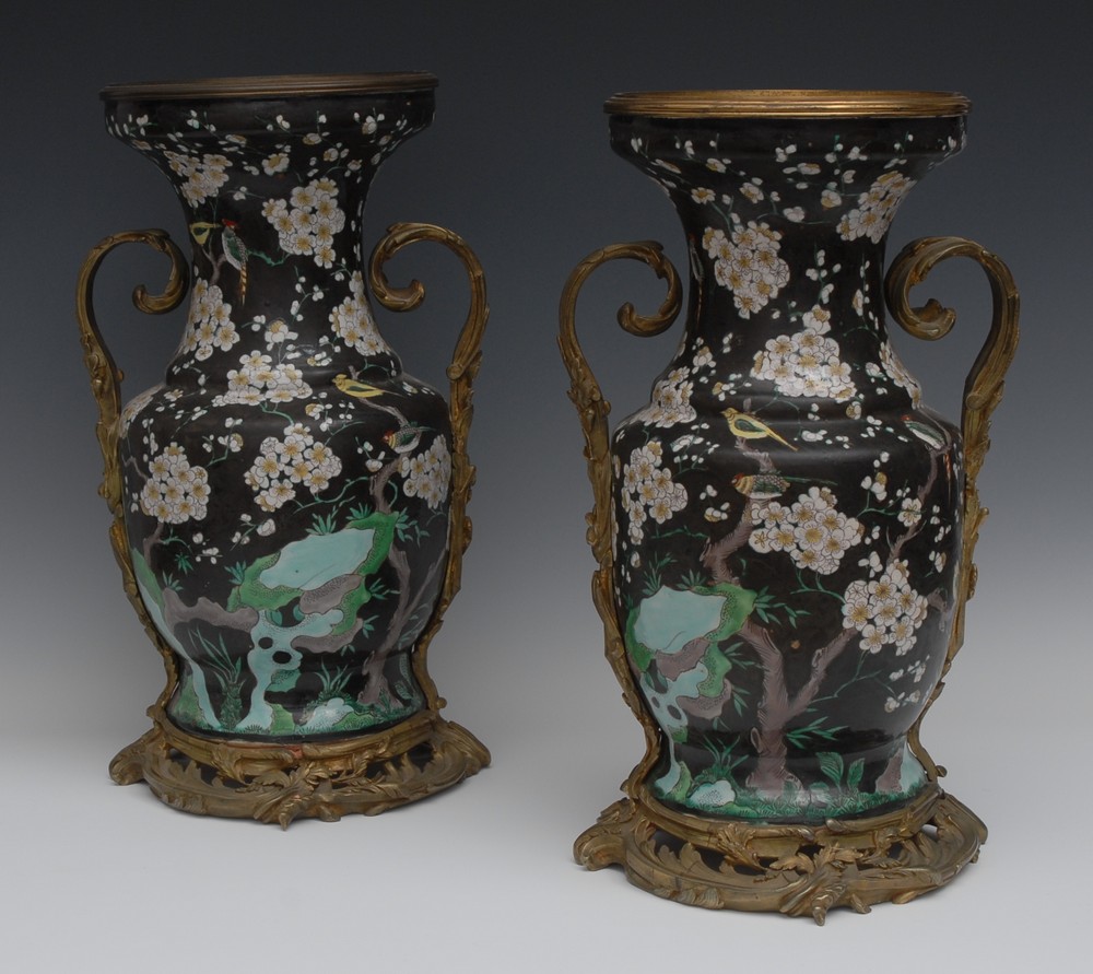 A pair of large ormolu mounted Chinese Famille Noir ovoid vases,