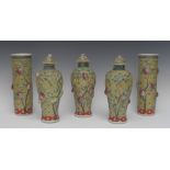 A Chinese famille verte garniture, comprising two sleeve vases and three baluster vases and covers,