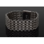 A diamond encrusted chain link bracelet,