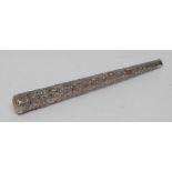 A tall Indian silver cane or parasol handle, embossed with rows of deities, lotus socle, 31.