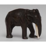 Japanese School (Meiji Period), a dark patinated bronze, of an elephant, standing four square,