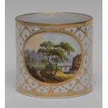 A 19th century Spode mug, painted with landscape within an oval, the ground with gilt husk trellis,