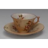 A Royal Worcester teacup and saucer,