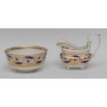 A Derby boat shaped cream jug, pattern 14, decorated in puce camaieu and gilt Regency scrolls,