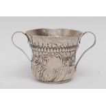 An early George III silver porringer, spirally fluted and chased with a fluted girdle,