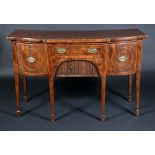 A George III mahogany shaped breakcentre sideboard,