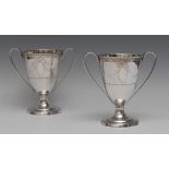 A pair of George III Old Sheffield plate ovoid loving cups, engraved with ribbon-tied swags,