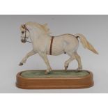 A Royal Worcester equestrian group, modelled by Doris Lindner, of Welsh Mountain Pony,