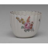 A Chelsea fluted tea bowl, painted with Meissen style summer flowers, brown line border,