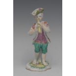 A Derby Pale Family figure, of a boy playing pipe, he stands wearing a hat with upturned brim,