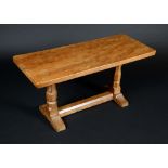 Robert Thompson, Mouseman of Kilburn - an oak rounded rectangular coffee table, outswept top,